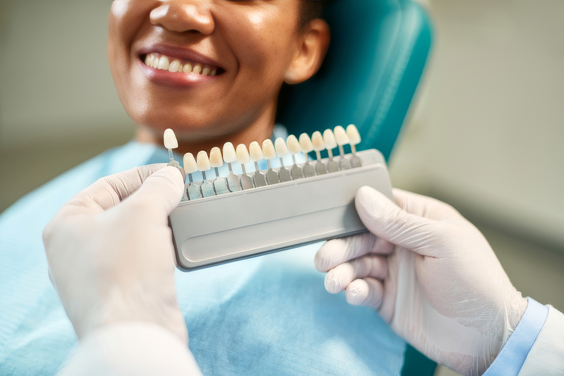A Doctor Showing A Variety Of Veneer Options