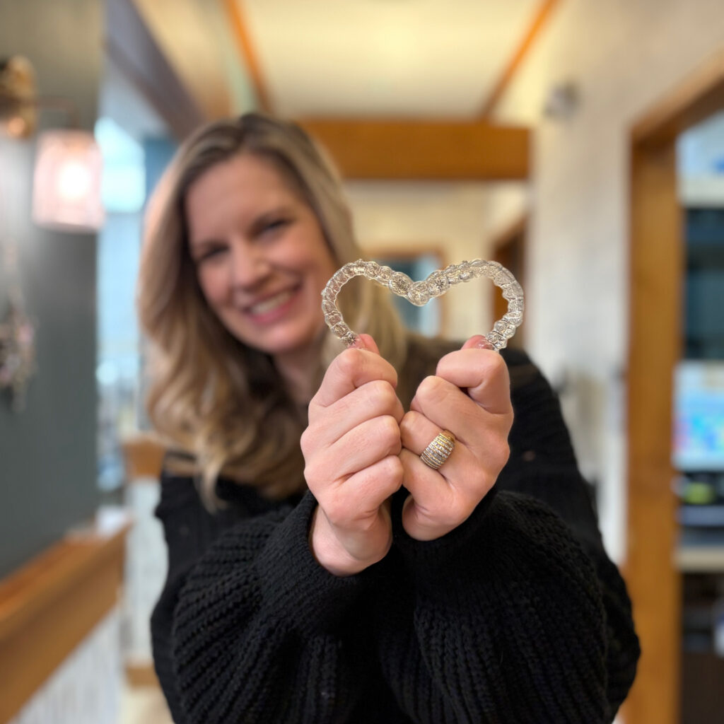 High Desert Dental Staff Member Displaying Invisailgn Trays